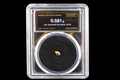 Colorado natural gold nugget in sealed slab, 0.581g, 20K, serial SGE-2026-00113, black background