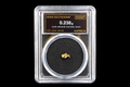 0.238g Australian natural gold nugget labeled 19.9K in sealed slab SGE-2026-00144 on a black background