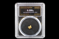 Australian gold nugget in sealed slab, 0.359g, 18.5K, serial SGE-2026-00143, black background