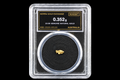 Australian gold nugget in sealed slab, 0.352g, 23.9K, serial SGE-2026-00133, black background