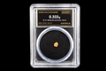 0.333g Australian natural gold nugget labeled 18.7K in sealed slab SGE-2026-00147 on black background
